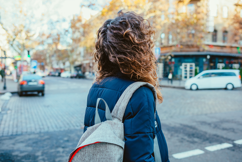 Woman walking on a crosswalk