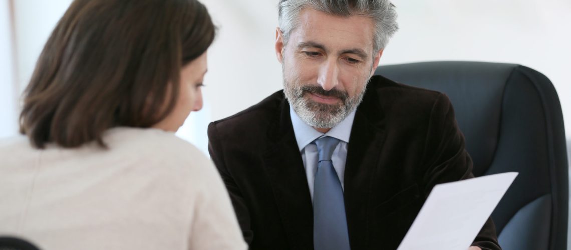 Attorney meeting client in office